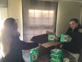 Girls organising first aid kits 