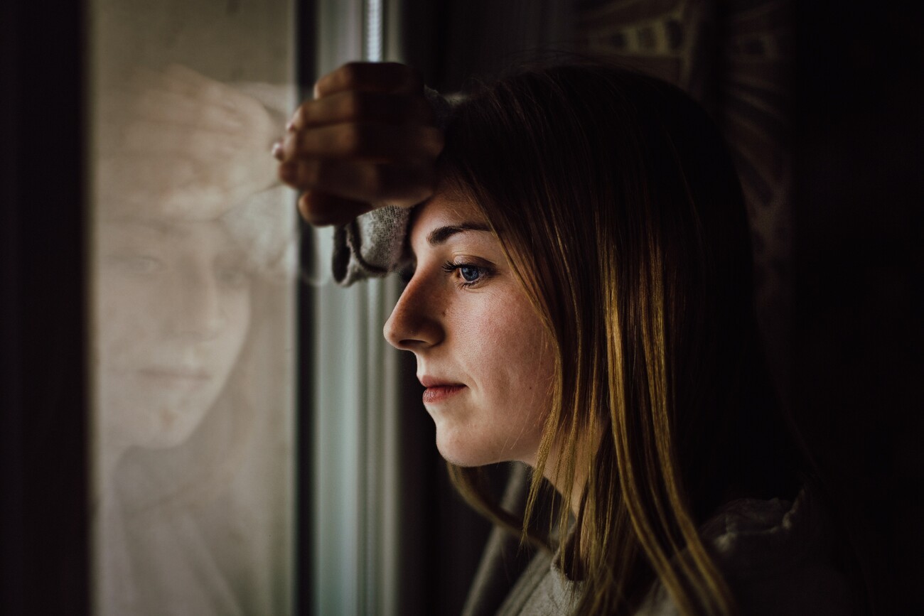 Girl looking out of window