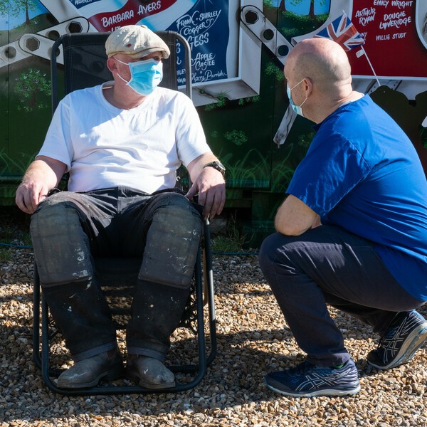 Man in deckchair with mask