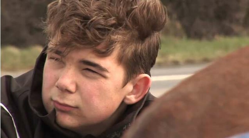 Traveller boy aged 14 with short dark hair and a black jacket