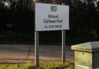 Sign saying Holwell Caravan Park