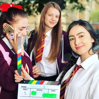 three girls smiling 