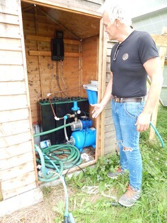 Off-grid: Richard Bennett and the pump and bore-hole that pumps fresh water from deep below the earth © Mike Doherty/TT