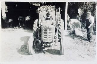 A young Jimmy Lee driving the tractor, Yarkhill Farm, 1976