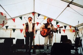 Chris Smith  (stage name - Walter Brick) and Les Scarrott (stage name - Lez Shed) as Brickshed at Upton-upon-Severn Folk Festival-early 1990’s