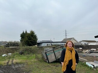 Jasmine Jones from Gypsy and Traveller Wales, the Celsa Steelworks looms in the background