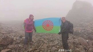 Flying the Romani flag during the Three Peaks Challenge