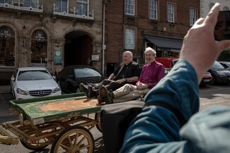 Archbishop of York, Stephen Cottrell, accompanied by the Bishop of Carlisle, James Newcombe, get a ride on a cart from Appleby Town to Fair Hill where they met with Appleby Fair Gypsy and Traveller representatives Billy Welch and Bill Lloyd (c) Eszter Halazi