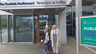 Campaigner Roseanna McPhee (right) at the Scottish Parliament on the 25th June. Photograph courtesy of Making Rights Real