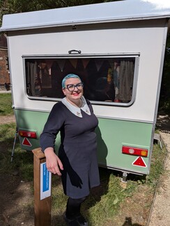 3.	Gemma in the MOH grounds with the Cold Comfort/ Kushti Shillow caravan.