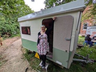 4.	Gemma in the MOH grounds with the Cold Comfort/ Kushti Shillow caravan.