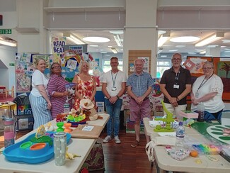 Nuneaton Library. Abeline McShane (2nd left) and ‘Hope’ organisers with PCC Philip Secombe in Blue checked shirt