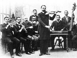 Hungarian Roma orchestra in the 1890's. By Unknown author - http://www.magyarnota.com/blog/A_magyar_nota.html, Public Domain, https://commons.wikimedia.org/w/index.php?curid=8719635