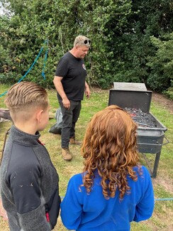 Jake Bowers with two pupils from Wolvey Primary School