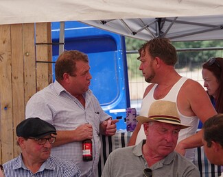 6)	Well known dealing man Jr Price (standing on the right)