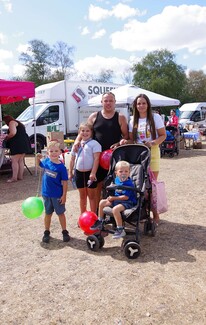 Freddy Stanley and family from Poole walking round the market
