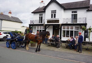 Joe Davidson's horse & carriage on the Friday drive outside the Golden Lion