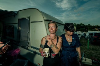 Two young woman standing in front of trailer