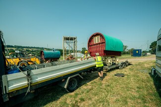 Long pick up van towing traditional bowtop wagon trailer